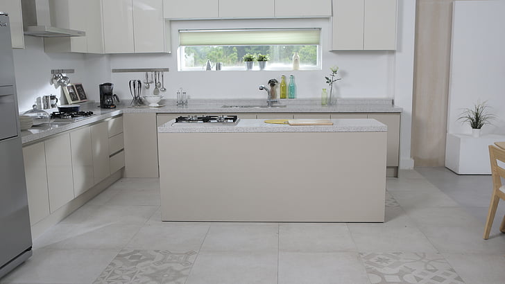 Stunning luxury kitchen design Mansarovar with central island feature.